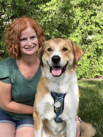 Image of a woman and a dog, Moose.